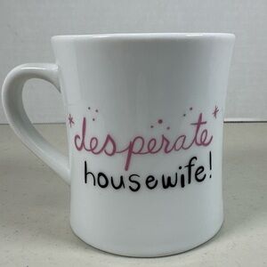 Wendy Tancock Design Toronto. “Desperate Housewife Coffee Mug”. Good condition.